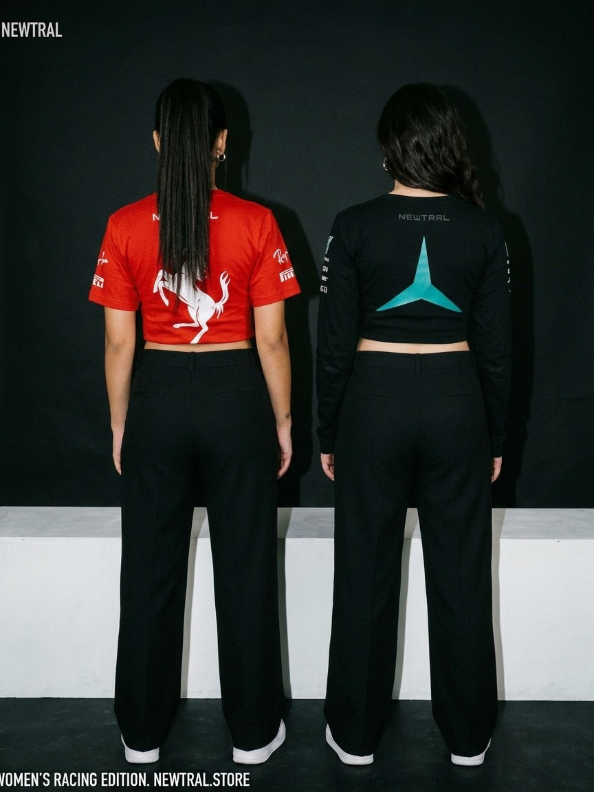 Ferrari Scuderia Women's Crop Tee (Red) and Mercedes-AMG Petronas Women's Longsleeve Crop (Black) bundle: Back view, both models, dark backdrop with a white bench/plinth behind them, matching black trousers